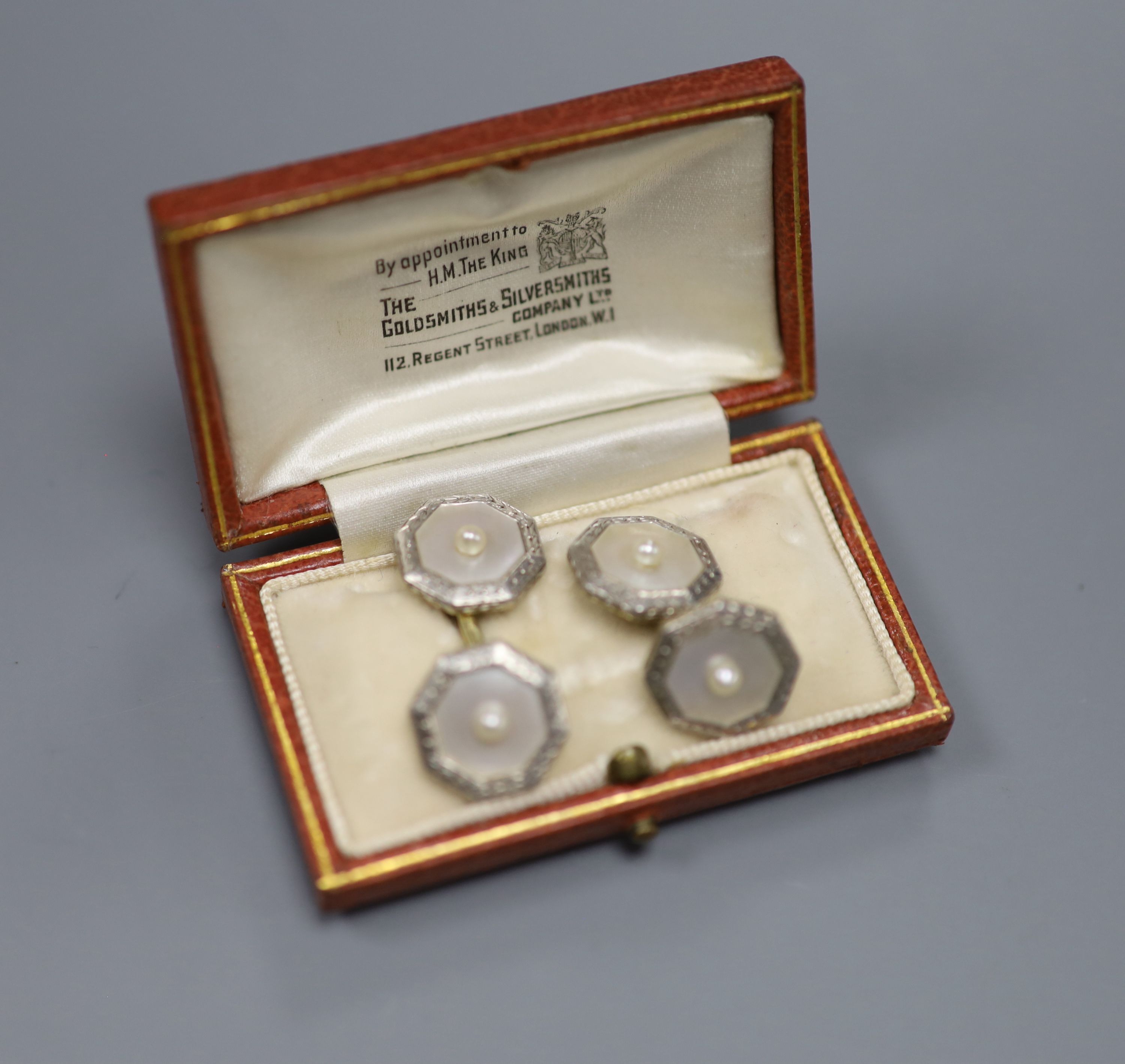 A pair of 1940s 14c, plat and mother of pearl octagonal cufflinks, gross 8 grams.